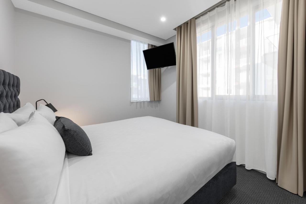 Meriton Suites North Ryde Sydney Zewnętrze zdjęcie A bedroom at the hotel